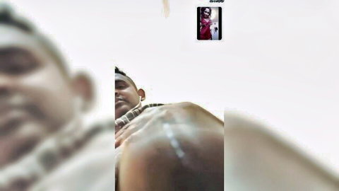Blurry close-up of Sudanese man in shirt, amateur scandal thumbnail