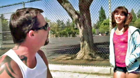 Elizabeth Bentley flirts outdoors in pigtails and short shorts with tattooed man