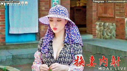 Chinese woman in floral hat and scarf, deep cleavage in unbuttoned blouse outdoors