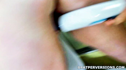 Blurry close-up of lesbian women in toothbrush mouth fetish play, freaky oral insertion