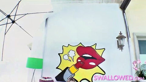 Stylized red lips blowing lipstick in explosive pop art for Swallowed rough sex video