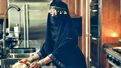 Nadia Ali in black hijab and niqab teasing in kitchen scene