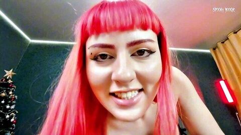 Pink-haired Makima cosplay beauty smiling seductively in femdom roleplay