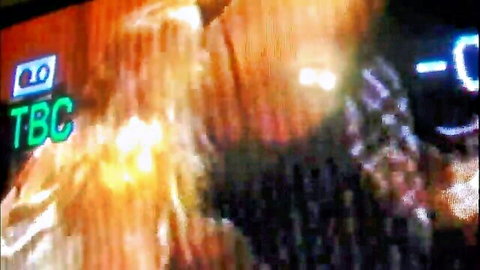 Blurry orange-toned closeup of hardcore fucking with green TBC watermark overlay