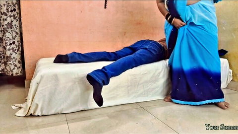 Indian MILF in blue saree lifts skirt teasing prone jeans-clad man on bed