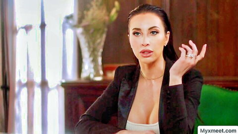 Seductive brunette in black blazer showing deep cleavage, teasing pose