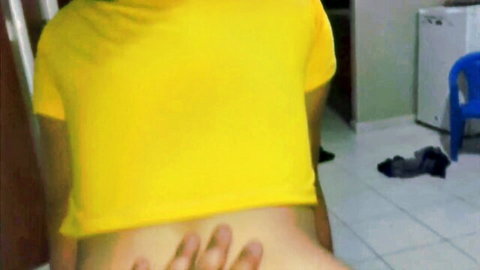 Man gropes sexy Latina's big bare ass cheeks from behind in yellow crop top