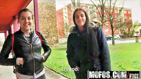 Two smiling young brunette teens in jackets posing outdoors in public amateur pickup scene