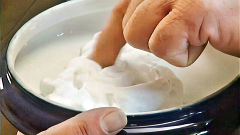 Hand dipping into whipped cream bowl, teasing food play from Teeny Exzesse 58