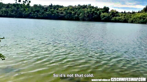 Serene outdoor lake scene from Czech wife swap video with rippling water not that cold.
