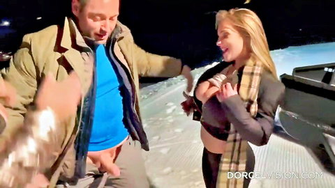 Blonde with exposed tits smiles as man pulls out hard cock outdoors on snowy slope