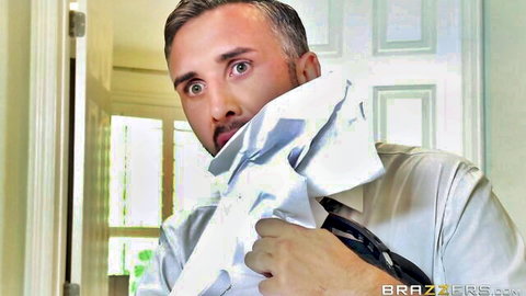 Shocked man in white shirt and tie covering face with towel in hallway