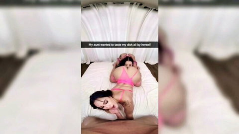 Curvy brunette in pink lingerie bends over bed, teasing big ass for dick