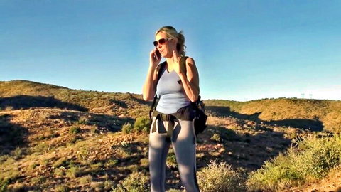 Jodi West blonde MILF hiking in tight gray leggings and tank top outdoors
