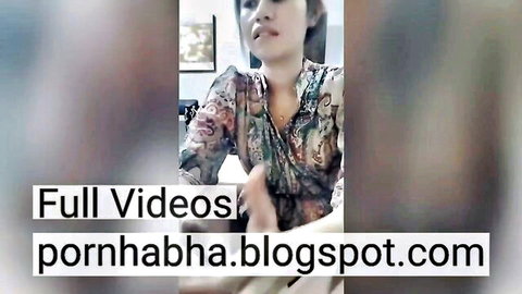 Indonesian woman in open patterned dress, seductive tease