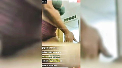 Muscular woman in purple bra posing in gym mirror solo