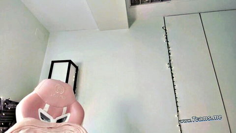 Empty pink gaming chair in webcam room setup for hot solo babe shows