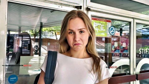 SweetGini pouting in white top and backpack outside building