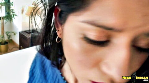 Seductive close-up of sexy Indian woman with glossy lips, smoky eyes and blue scarf