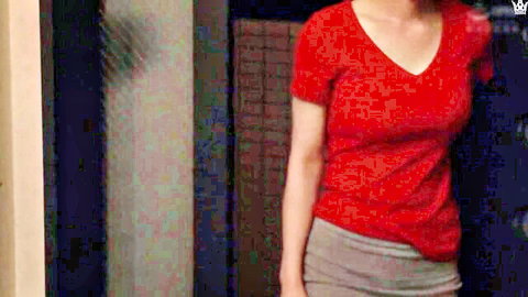 Sexy Asian MILF in tight red V-neck top and short gray skirt teasing her juicy ass