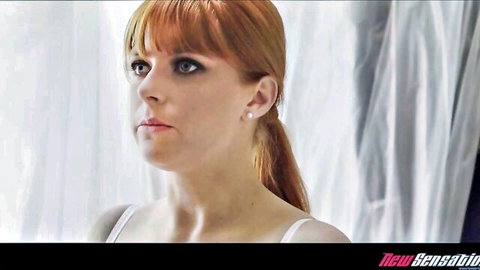 Penny Pax redhead in white lingerie, seductive side glance