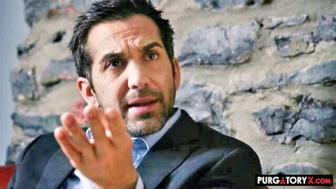 Handsome suited man gesturing in intense scene from Sofi Ryan hardcore video