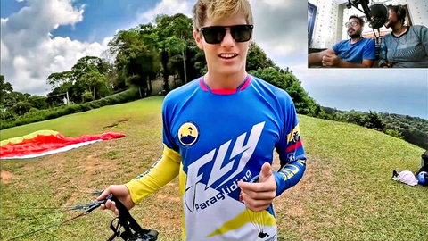 Girlnexthot1 blonde skydiver in blue jersey holding parachute outdoors on hill