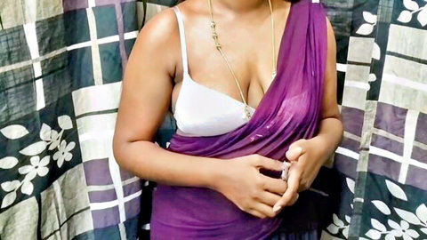 Desi bhabhi in sheer purple saree revealing white bra and deep cleavage