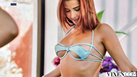 Skinny redhead in sheer blue strappy lingerie teasing her perky tits and pussy outdoors