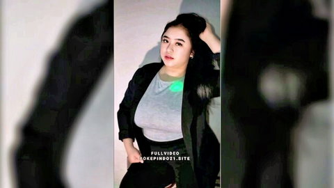 Sexy Indonesian amateur girl in tight gray top and blazer posing seductively with big tits cleavage tease