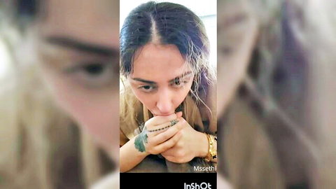 Sexy Indian girl with purple hair puckers full lips close-up hand with gold watch and beads