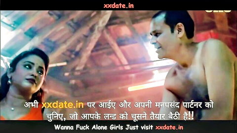 Indian couple in intimate kitchen moment, woman in red saree, man shirtless