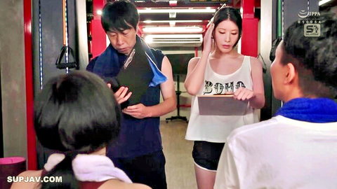 Asian JAV gym scene with fit women in tank tops and shorts teasing trainers