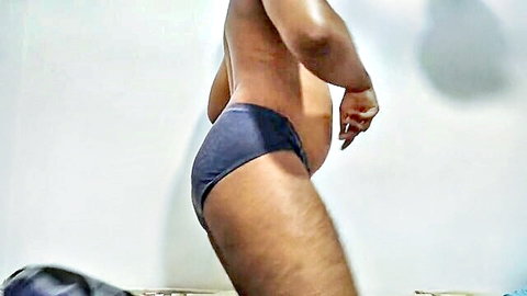 Hairy Indian guy in tight blue speedo showing big cock bulge and fat ass cheeks