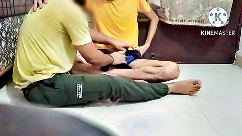 Young Indian guys in gay amateur handjob, friend grabs bulge with green pants pulled down