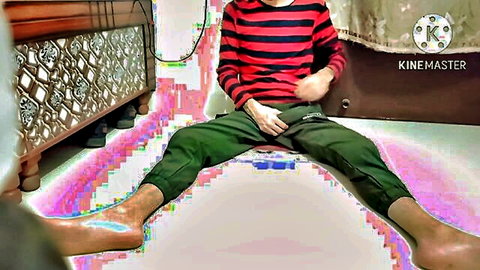 Amateur South Asian guy sits legs spread wide with green pants pulled down exposing bare thighs and feet