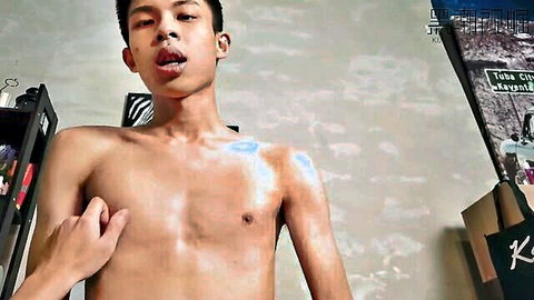 Young Asian twink shirtless teasing with tongue out