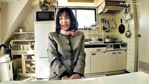 Smiling Asian housekeeper in gray suit invites to fuck