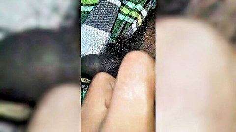Pale hand gripping thick black cock handjob closeup with pubic hair and plaid fabric