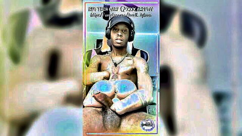 Muscular ebony stud with headphones spreads legs showing big black cock and shiny blue balls