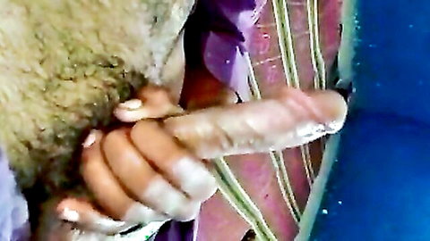South Asian woman with pink nails stroking thick veiny erect cock in glossy handjob closeup