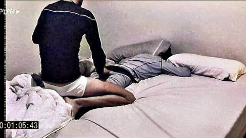 Athletic man in underwear straddling another on bed, losing virginity gay scene