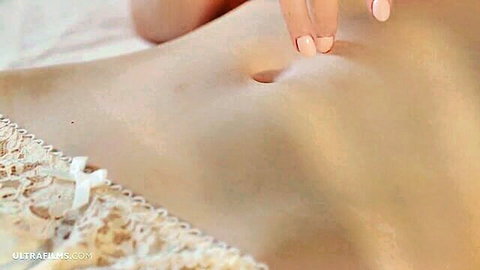 Skinny fair babe teases navel with pink nails in white lace lingerie solo