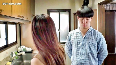 Long-haired Japanese brunette in kitchen turning to face young man in checkered shirt taboo scene