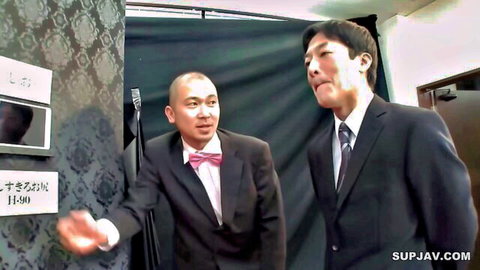 Two suited Asian men in JAV sex shop fantasy setup