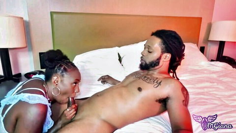 Omgiana in lingerie gives oral to tattooed black stud on bed