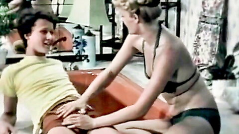 Blonde bikini babe gropes guy's crotch through shorts in vintage handjob tease
