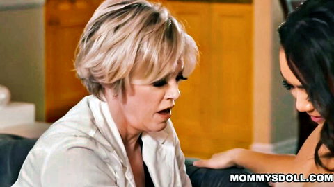 Blonde MILF with open mouth intimately facing sexy brunette in lesbian encounter