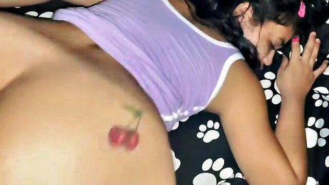 Young morena with cherry tattoo exposes curvy ass in purple tank top