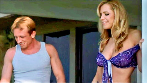 Blonde babe in skimpy purple bikini top flaunts massive tits smiling at redhead stud